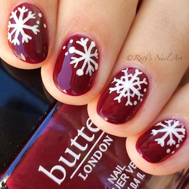 Dark Red Nails With White Snowflakes