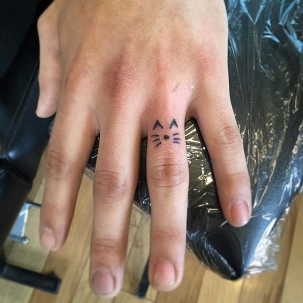 Small Cat Finger Tattoo