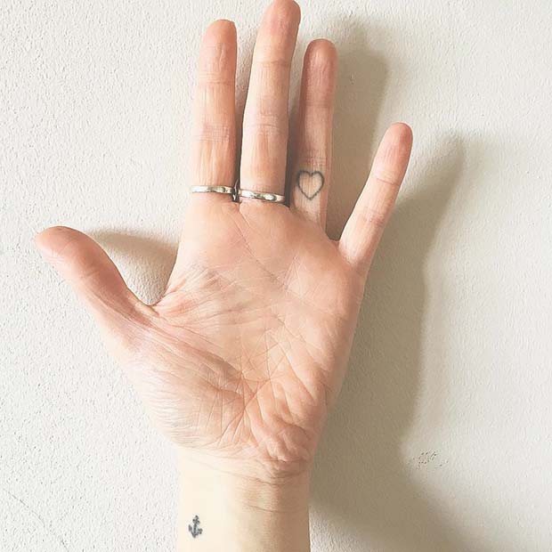 Subtle Heart Finger Tattoo