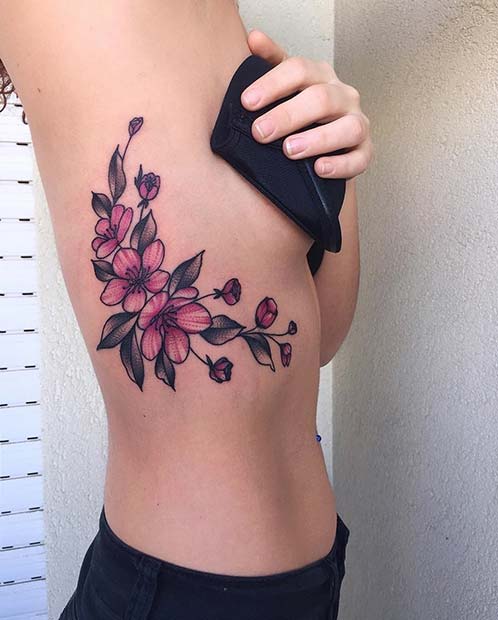Large Bright Flower Rib Tattoo
