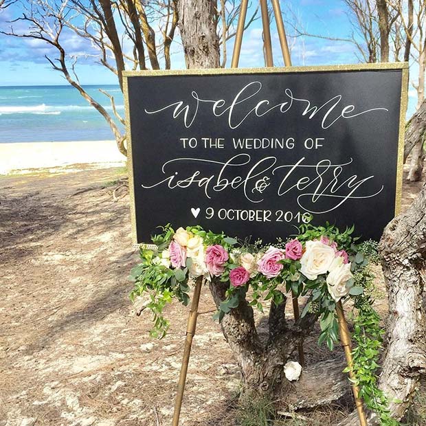 Outdoor Wedding Sign Idea with Fresh Flowers