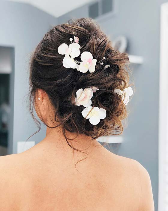 Messy, Floral Wedding Updo
