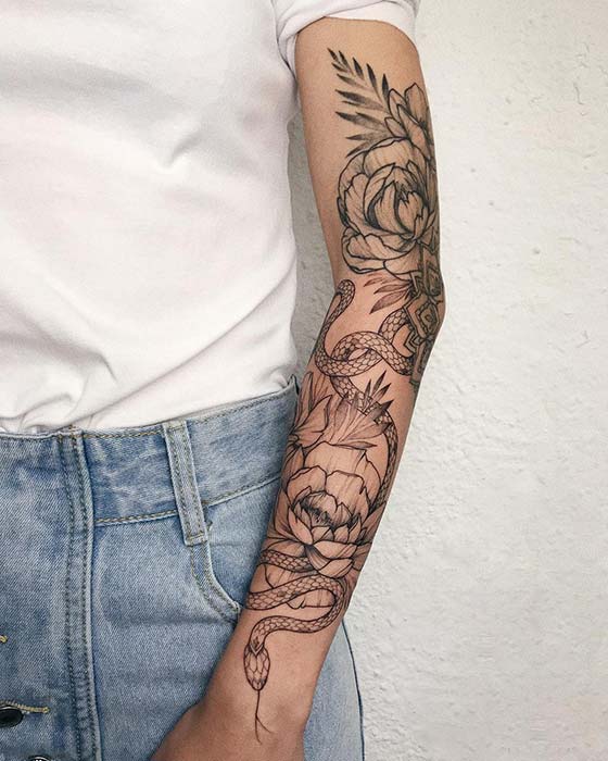 Floral Arm Tattoo with a Snake