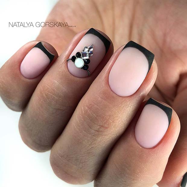 Short Nails with Black Tips and a Crystal Accent Design