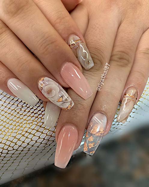 Trendy Coffin Nails with a Floral Accent Design