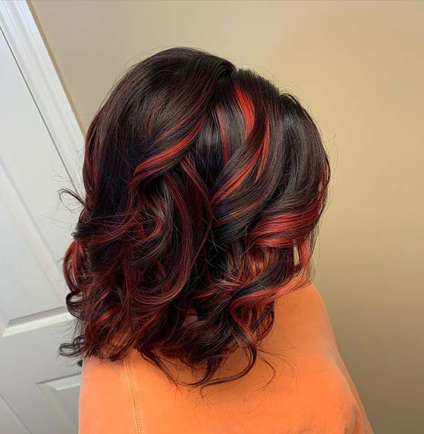 Black Hair with Cute Curls and Red Highlights