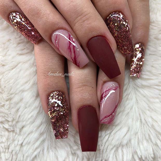 Matte Burgundy Nails with a Marble and Glitter Design