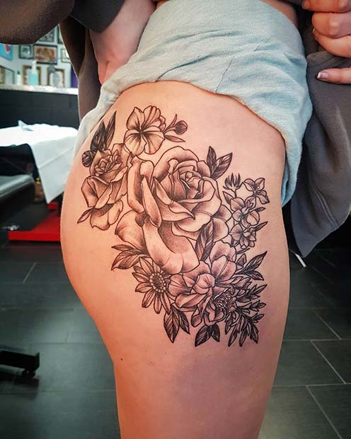 Flowers and a Butterfly Thigh Tattoo