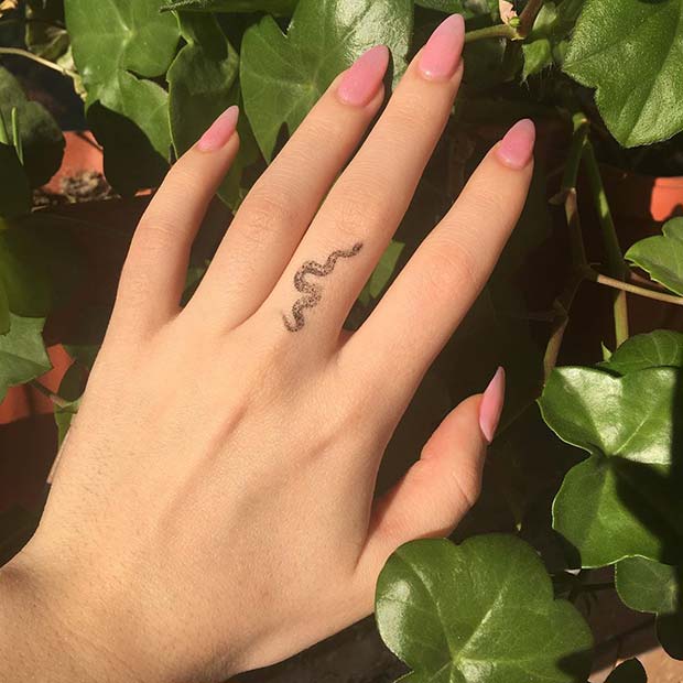 Tiny Snake Finger Tattoo 