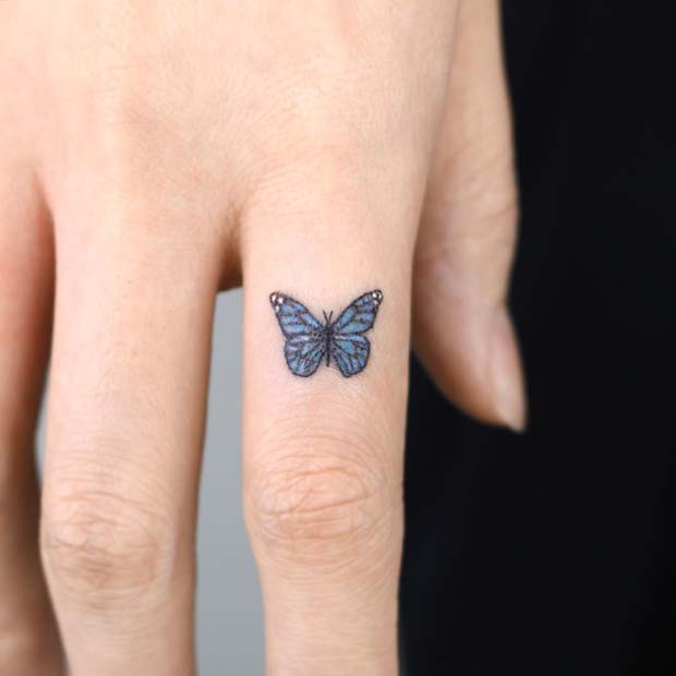 Tiny Butterfly Finger Tattoo