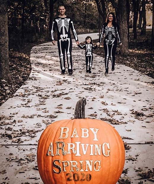 Skeleton Family with a Pumpkin Announcement 