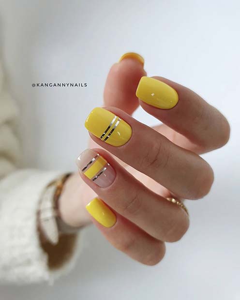 Trendy Yellow Nails with Silver Stripes